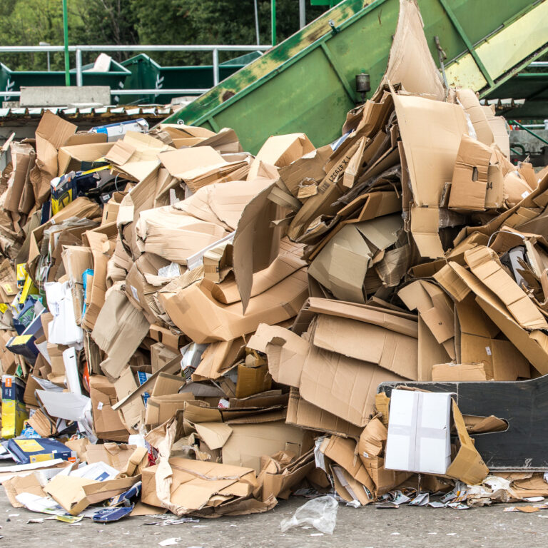 A large pile of cardboard packaging waste